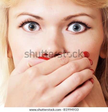 bright picture of pretty woman with hands over mouth