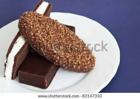 three chocolate cake on white plate