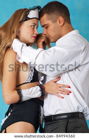 Beautiful kissing  love couple on blue background