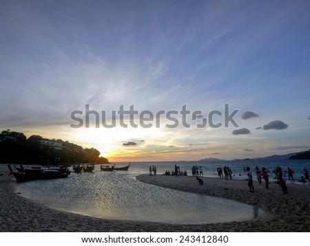 Sunset with people at an island in the Andaman sea