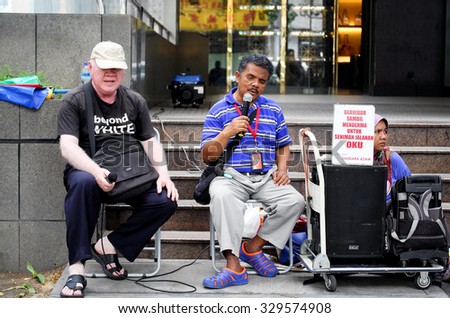 KUALA LUMPUR, MALAYSIA - Aug 16, 2015 - Disabled (blind) street performers at Jalan Tuanku Abdul Rahman, Kuala Lumpur, performing for donation.