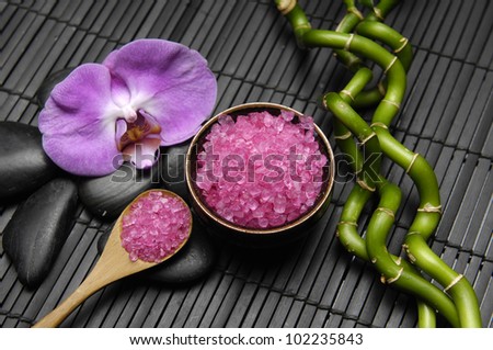 spa settings-lucky bamboo, salt in bowl, orchid, zen stones on mat