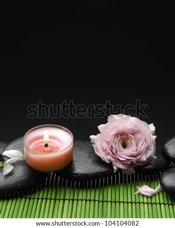 rose with stones and candle green mat