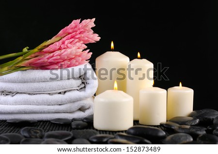 Spa feeling with Ginger flower with ,towel ,white candle on pebbles