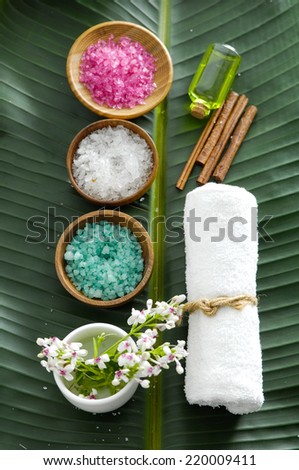 colorful sea salt ,flower in wooden bowl with towel, flower on banana leaf