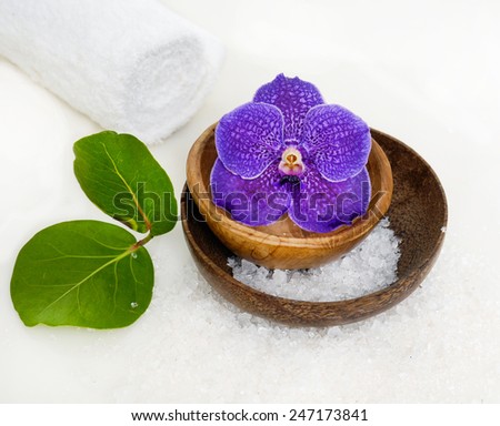 bowl of blue orchid with salt and leaf and son towel