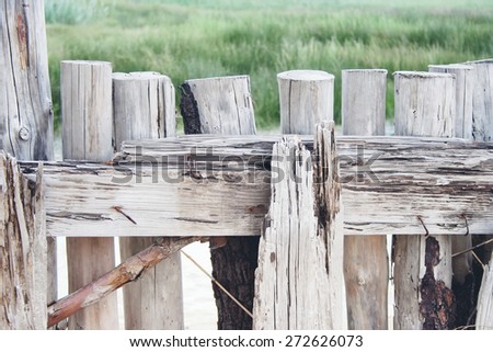 an old fence on the beach