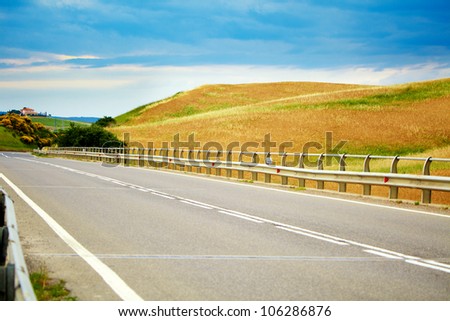 Typical landscape in Val d'Orcia ( Tuscany, Italy) at summer. Road .