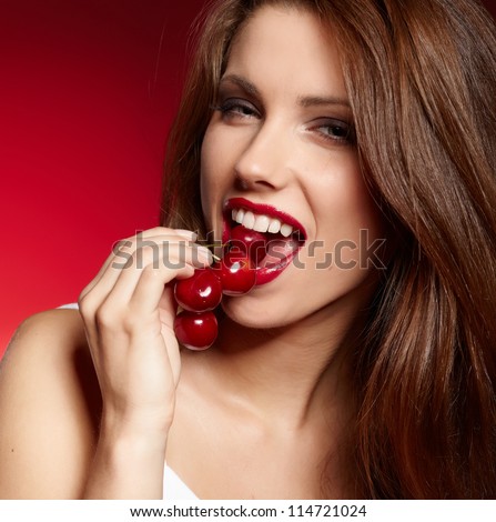happy woman with cherries over white