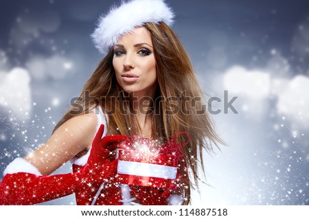 beautiful sexy girl wearing santa claus clothes  with christmas gift