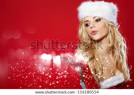 stock photo : Photo of fashion Christmas girl blowing snow.
