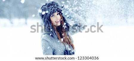 Girl playing with snow in park Girl playing with snow in park