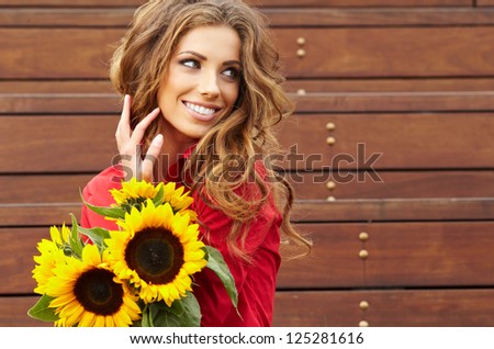 Fashion Woman With Sunflower At Outdoor.