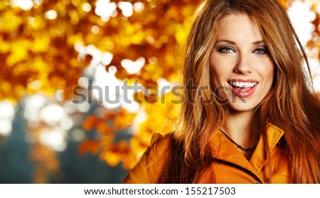 Beautiful Elegant Woman Standing In A Park In Autumn