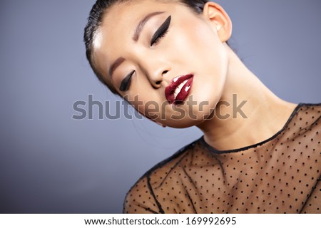 Asian woman beauty face closeup portrait. Beautiful attractive mixed race Chinese Asian