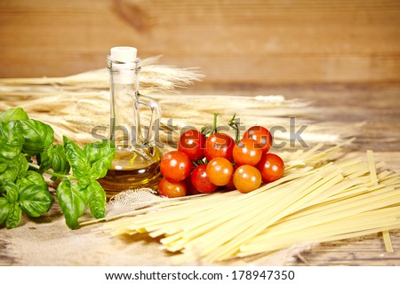 Raw pasta,vegetables ,olive oil and spices