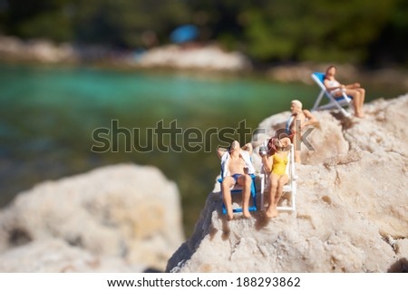 Miniature figurine an a beach in swimming costume