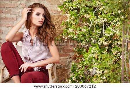 woman on the terrace of her Italian home in Tuscany