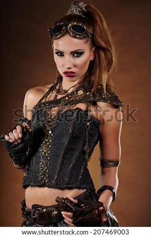 Steampunk woman over gunge background. . Fantasy fashion for cover.