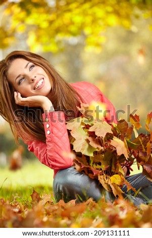 Fall woman- Autumn portrait of happy lovely and beautiful  young woman in forest in fall colors.
