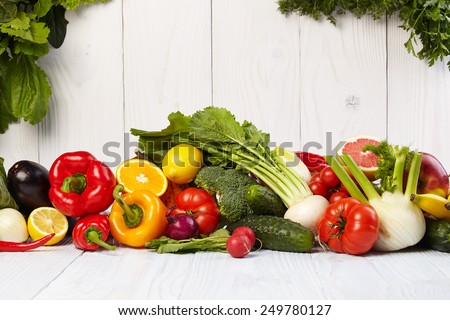 Fruit and vegetable borders on white wooden old table