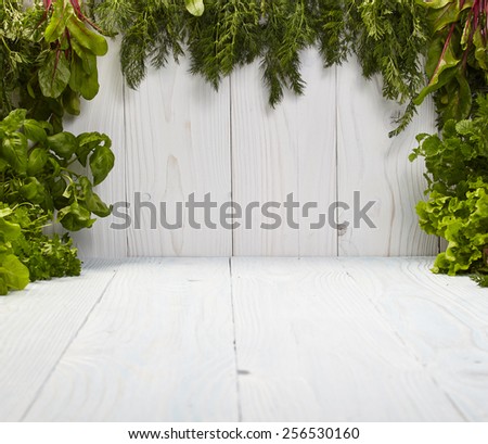 Green frame on white boards made from herbs