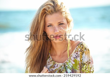 Portrait of the beautiful girl close-up, the wind fluttering hair.