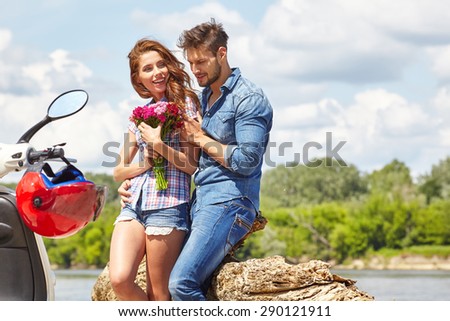 Love couple on a trip on the river