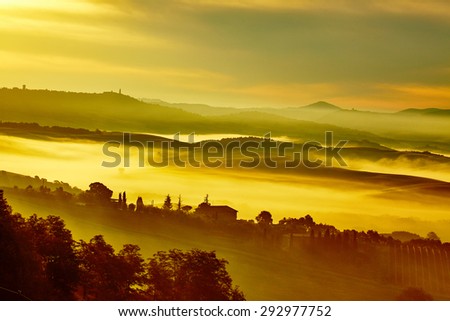 Scenic Tuscany landscape with rolling hills and valleys in golden morning light