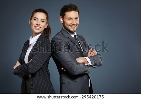 Business couple on blue background