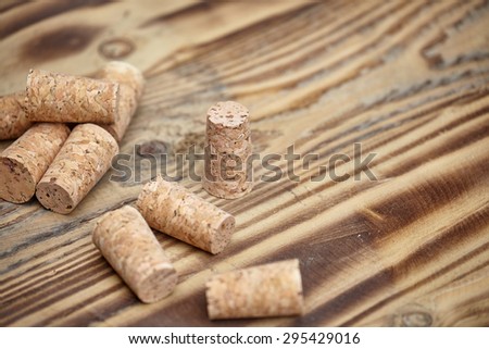 Many wine corks on wood barrel