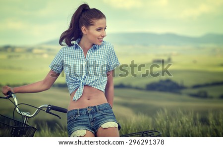 beautiful girl with vintage bike outdoor, summer time