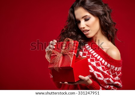 beautiful happy woman opening gift box