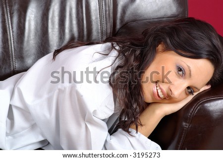 Beautiful woman lying on the couch in the living room
