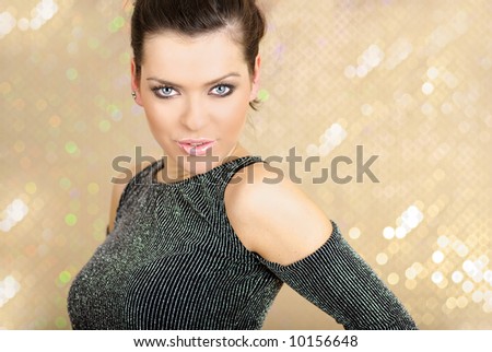 Portrait of glamour woman over gold background