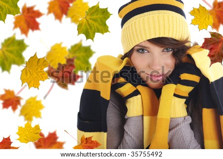 Beautiful  woman wearing hat and gloves  and maple leaves