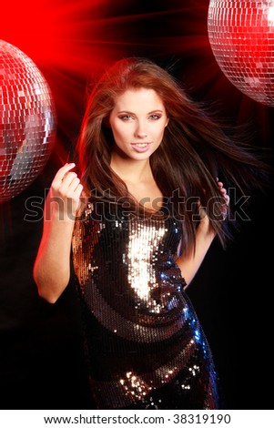 sexy girl dancing over mirror ball background