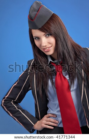 Beautiful air hostess isolated on one colour background