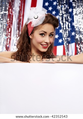 American girl holding blank board. Flag background