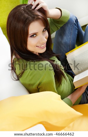 woman at home reading a book, spring concept