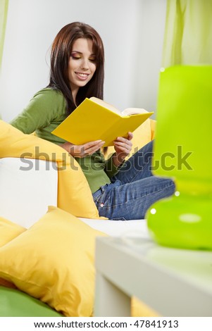 woman at home reading a book, spring concept