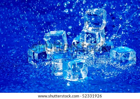 Melting ice cubes in rain on blue background