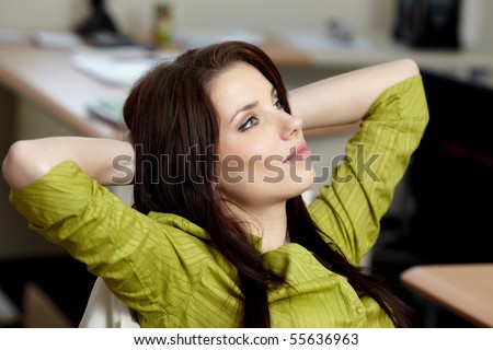 Beautiful happy business woman on blur office  background