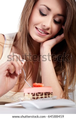Young happy woman with cake at home
