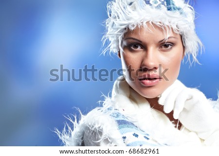 Portrait of beautiful young woman wearing fashion winter clothing