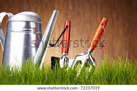 Garden tools on wooden wall