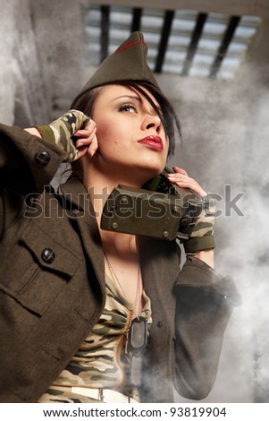 Beautiful girl in military clothes. studio shot