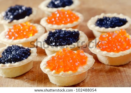 basket with red and black caviar