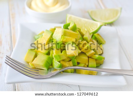 salad with white sauce and avocado