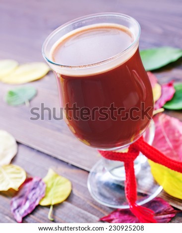 cocoa drink in cup and on a table